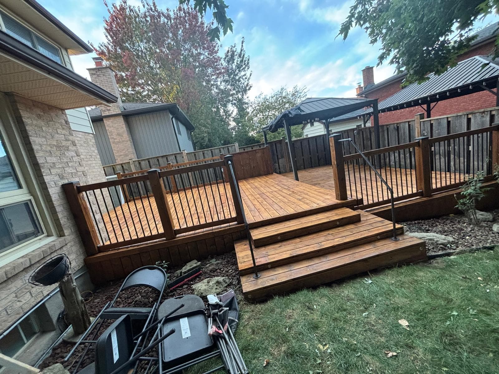 Completed stained deck viewed from the backyard steps