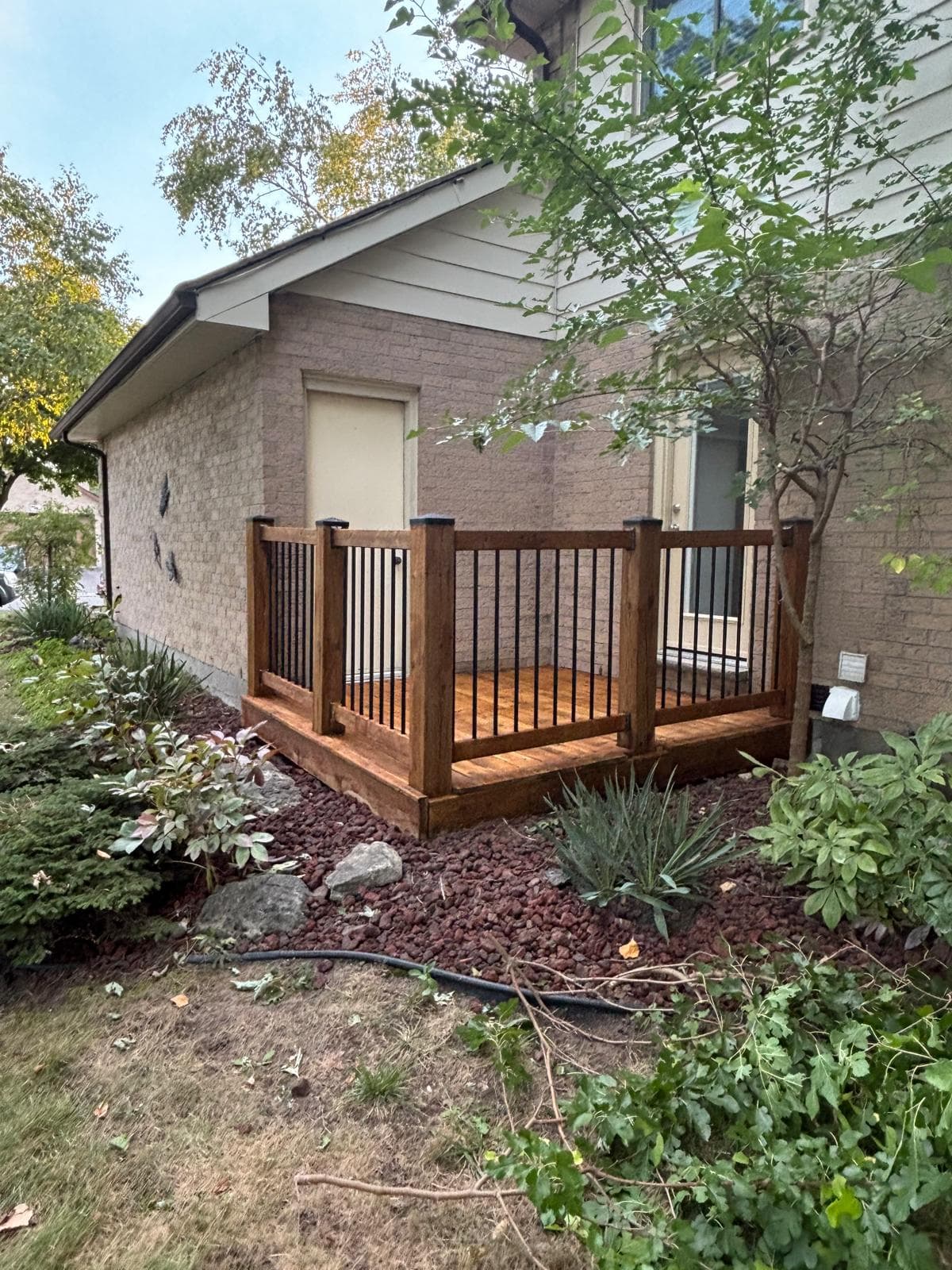 Exterior view of a completed stained side deck landing